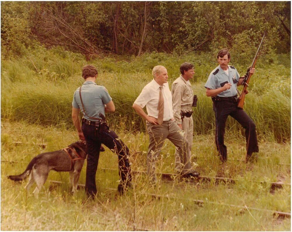 Officer and K-9s searching the woods